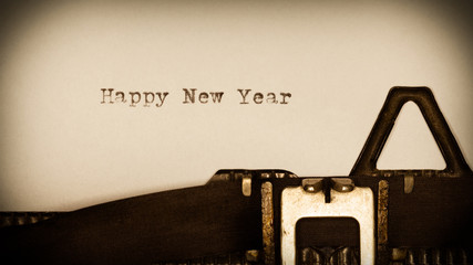 happy new year - written on old typewriter with vignet