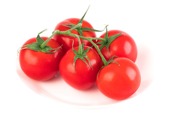 Fresh raw bunch tomatoes isolated on white background