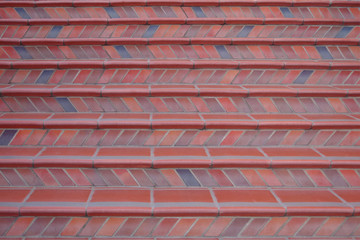 Close-up sectional view of red clay tiled steps going up an urban walkway