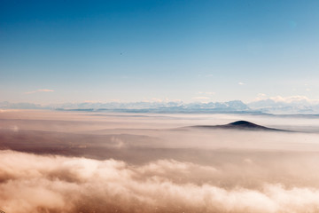 birds eye view of the mountains in the clouds