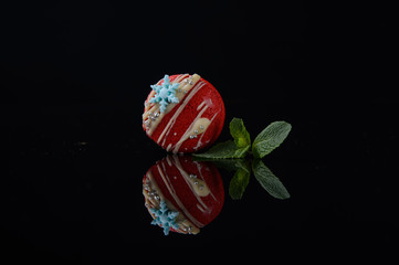 red macaroons on a black background1