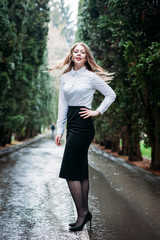 Young business woman walking outdoors in Park