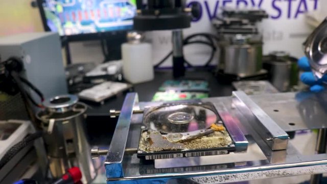 Broken, dusty hard drive at a data recovery center