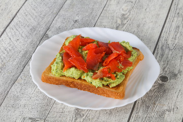 Toast with guacamole and salmon