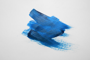 Paint strokes on white background background, top view. Color of the year 2020 (Classic blue)