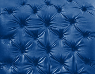 Texture of the skin on couch. Classic blue toning trend 2020 color