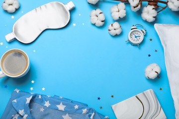 Flat lay composition with sleeping mask on light blue background, space for text. Bedtime...