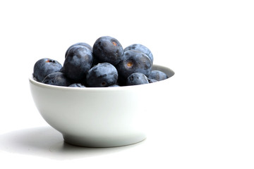 white bowl of fresh blueberry isolated on white bacground. Horizontal image