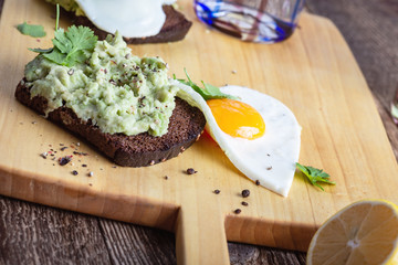 Brunch on Valentine's Day,  avocado toasts with fried egg