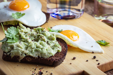 Brunch on Valentine's Day,  avocado toasts with fried egg