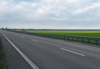 Beautiful view of asphalt highway without transport