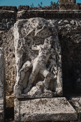 Hercules carving on a stone.