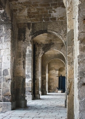 Fototapeta na wymiar Stone arches in an old church