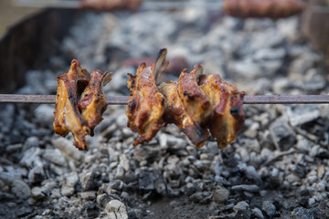 Lula kebab on skewers , traditional Caucasian dish, close-up . Appetizing lula kebab grilled on metal skewer. Shish kebab on a metal stick, top view.