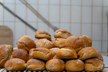 Homemade of baked bread on wooden table background in rustic bread bakery
