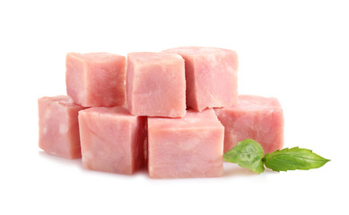 Cubes of tasty fresh ham with basil isolated on white