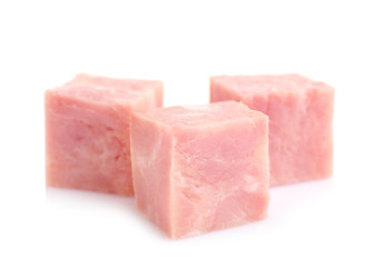 Cubes of tasty fresh ham isolated on white
