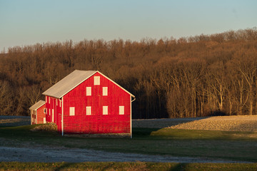 Red Barns and Farm Fields in a Winter Sunset