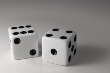 two dice on a white table