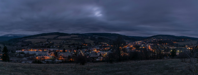 Obraz na płótnie Canvas View over Vimperk town in winter dark cold evening