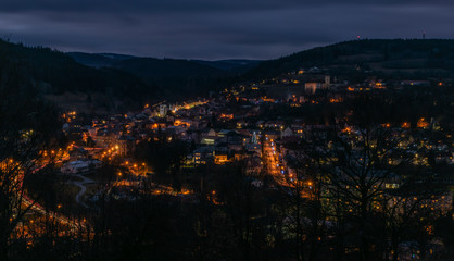 Fototapeta na wymiar View over Vimperk town in winter dark cold evening