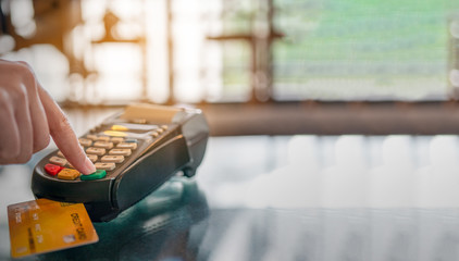 Woman paying credit card and entering pin code on credit card swipe machine for package promotion zero interest, webinar banner