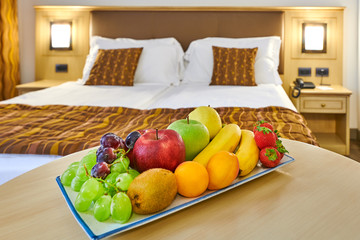 complimentary fruit basket in the hotel room,with free space for the welcome message