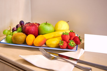 complimentary fruit basket in the hotel room,with free space for the welcome message