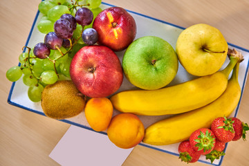 complimentary fruit basket in the hotel room,with free space for the welcome message
