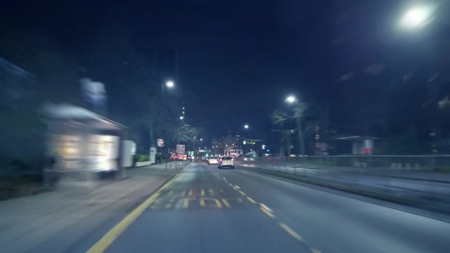 Dashcam time lapse at night.  Zooming through UK city streets at night time.