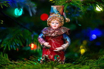 Vintage toys on a Christmas tree close-up, holiday traditions. Small depth of field