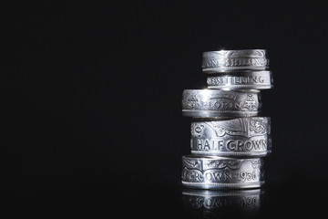 stack of coins on black background