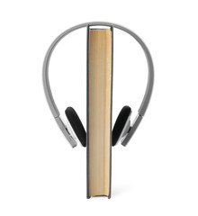 Book and modern headphones isolated on white