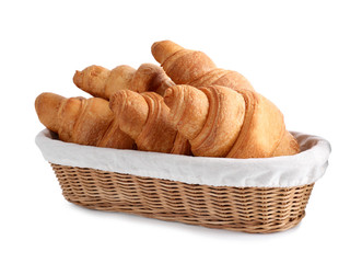 Tasty croissants in wicker bowl isolated on white