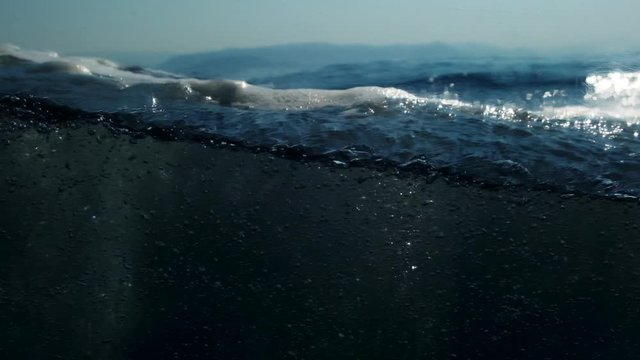 Sea level from moving glass boat. Prores 422 10 Bit slow motion.