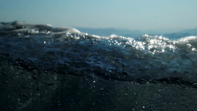 Sea level from moving glass boat. Prores 422 10 Bit slow motion.