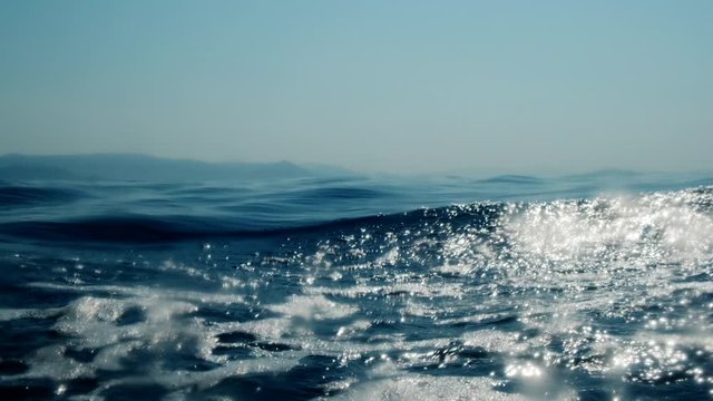 Sea level from moving glass boat. Prores 422 10 Bit slow motion.
