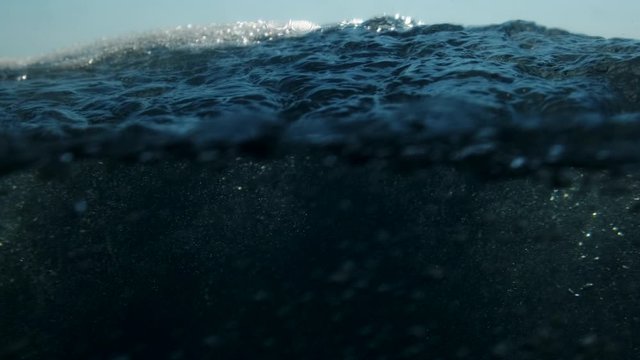 Sea level from moving glass boat. Prores 422 10 Bit slow motion.