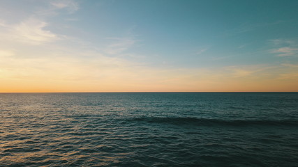 Landscape and sunset on the coast contemplating the breaking of the waves on the cliffs
