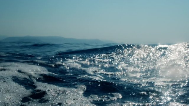 Sea level from moving glass boat. Prores 422 10 Bit slow motion.