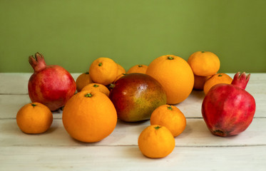 Fruit. Orange, pomegranate, mandarin, mango. Fruit on a white background. Eco-friendly fruits, zero waste.