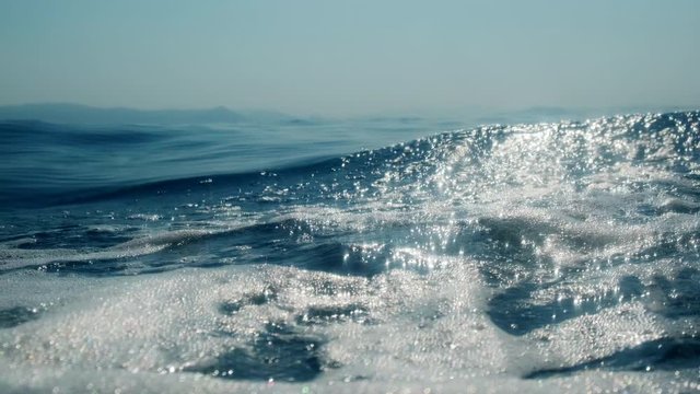 Sea level from moving glass boat. Prores 422 10 Bit slow motion.