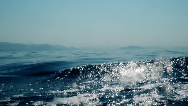 Sea level from moving glass boat. Prores 422 10 Bit slow motion.