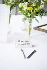 Wedding guest tree, notebook and bouquet of flowers