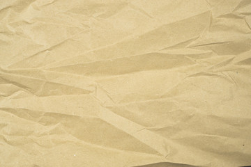 recycled packing paper in natural beige color, crumpled carton texture