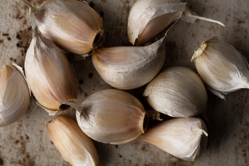 Garlic cloves on a wooden board