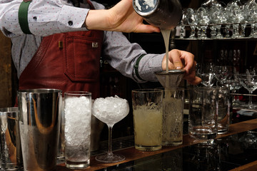 bartender pouring beer in a glass