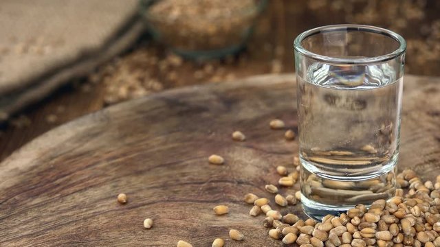 Wheat Liqueur shot on a rotating vintage plate (seamless loopable)