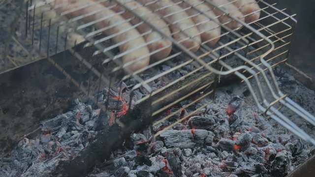 Grill grille and barbecue and mangala mesh. Preparation of sausage on a fire