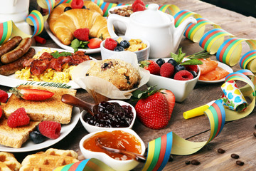 Breakfast served with coffee, orange juice, croissants, cereals and fruits. Balanced diet. Continental breakfast on carnival or new year